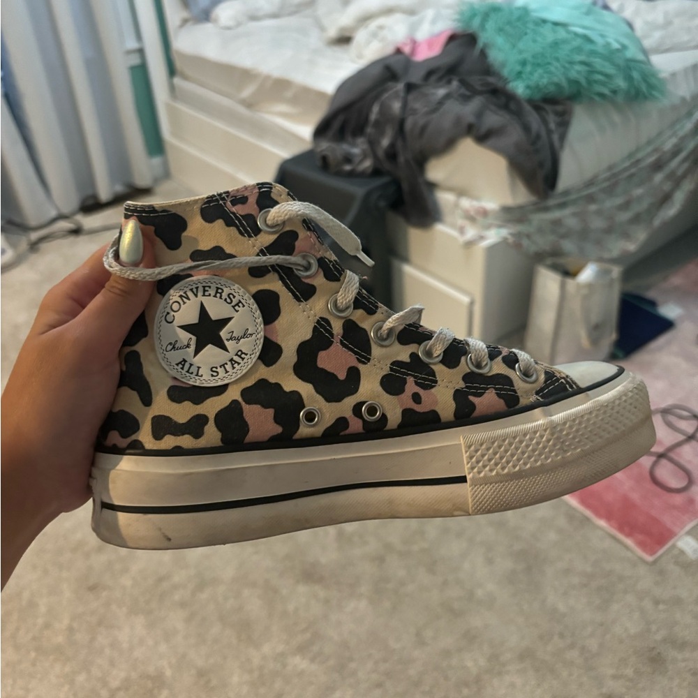 White and pink leopard print converse
